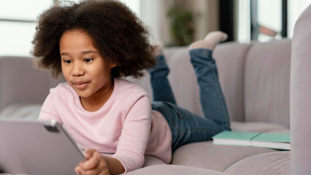 Child using interactive phonics learning app on tablet