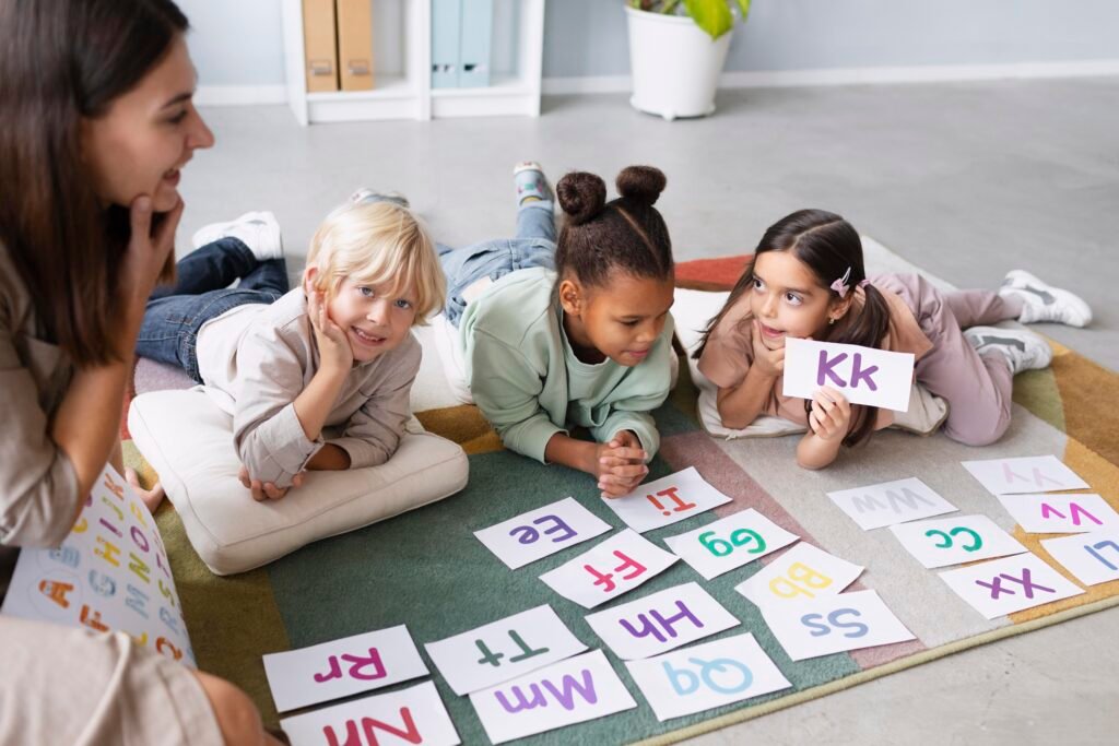 Children playing with alphabet blocks during a phonics readiness activity