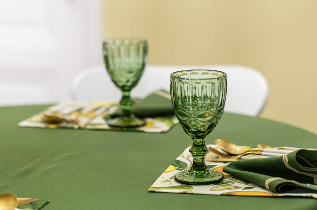 Event table styled with moss green cheesecloth gauze 120 inch for rustic elegance