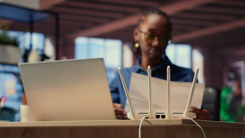 iPhone 16 Pro Max connected to 6K external monitor with USB-C and Wi-Fi 7 router