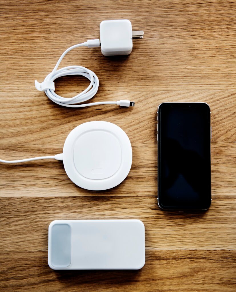 iPhone 16 Pro Max with fast charging adapter and MagSafe Duo 2 charging AirPods.
