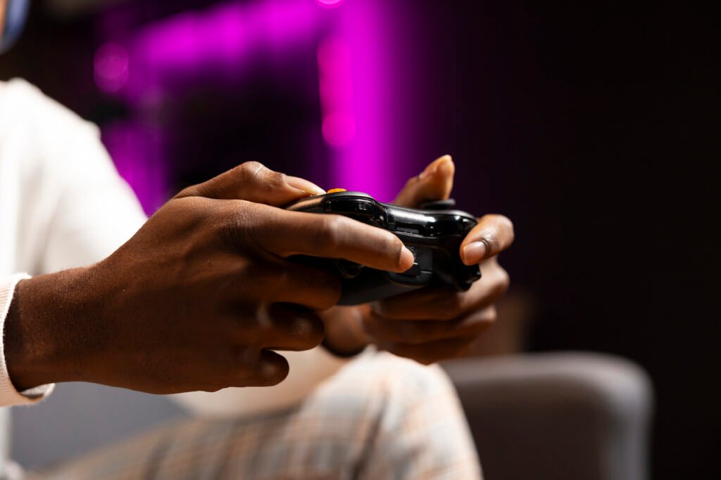 8Bitdo Ultimate 3-Mode Controller close-up with USB-C charging port and wireless dongle
