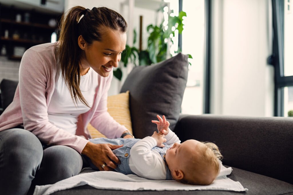 Baby wearing Mama Bear Gentle Touch Diapers during playtime