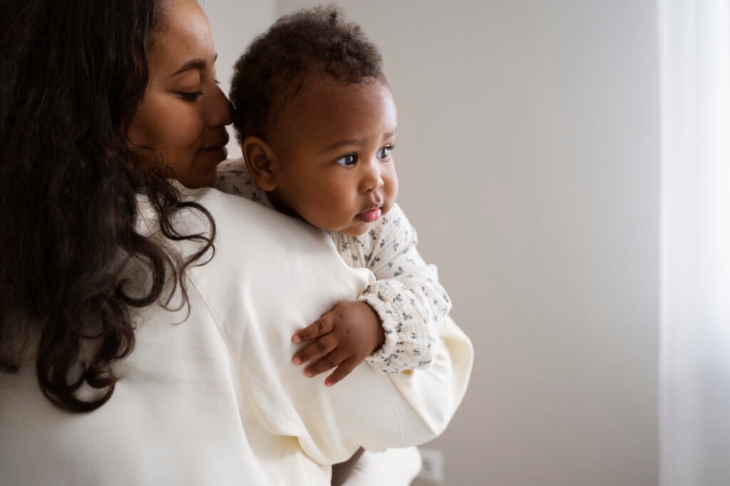 Parent bonding with baby wearing Mama Bear Gentle Touch Diapers