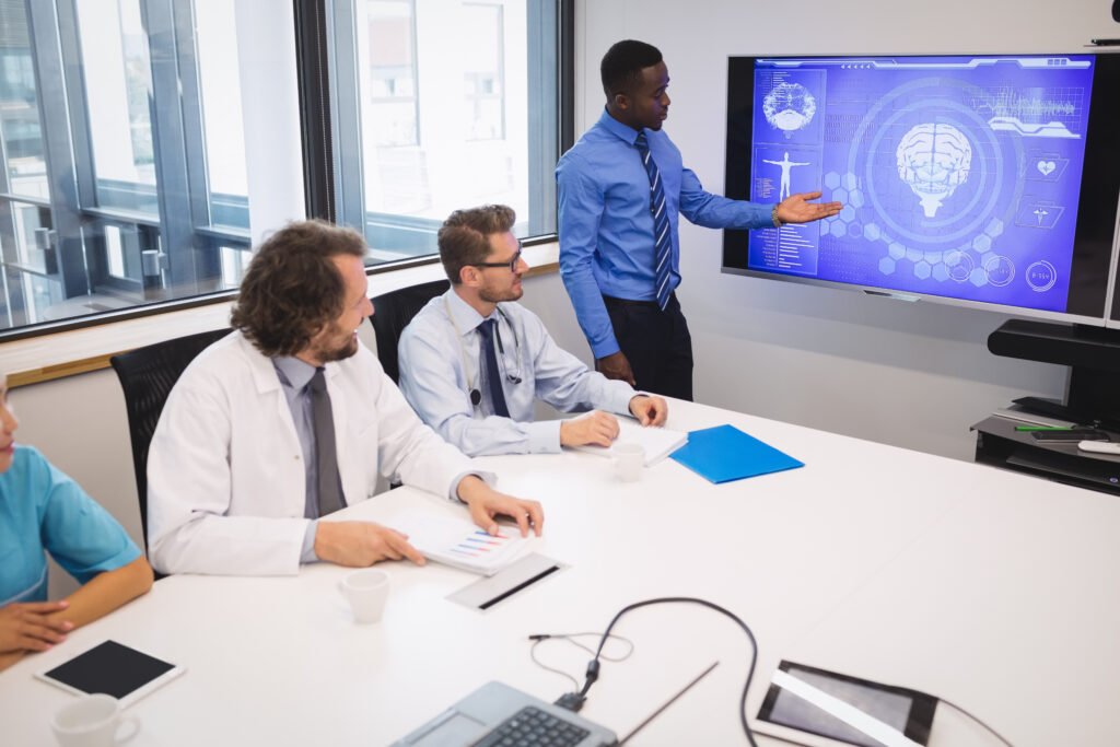 Image of researchers and clinicians analyzing cognitive data and brain activity graphs validating CogniFit’s scientific foundation.